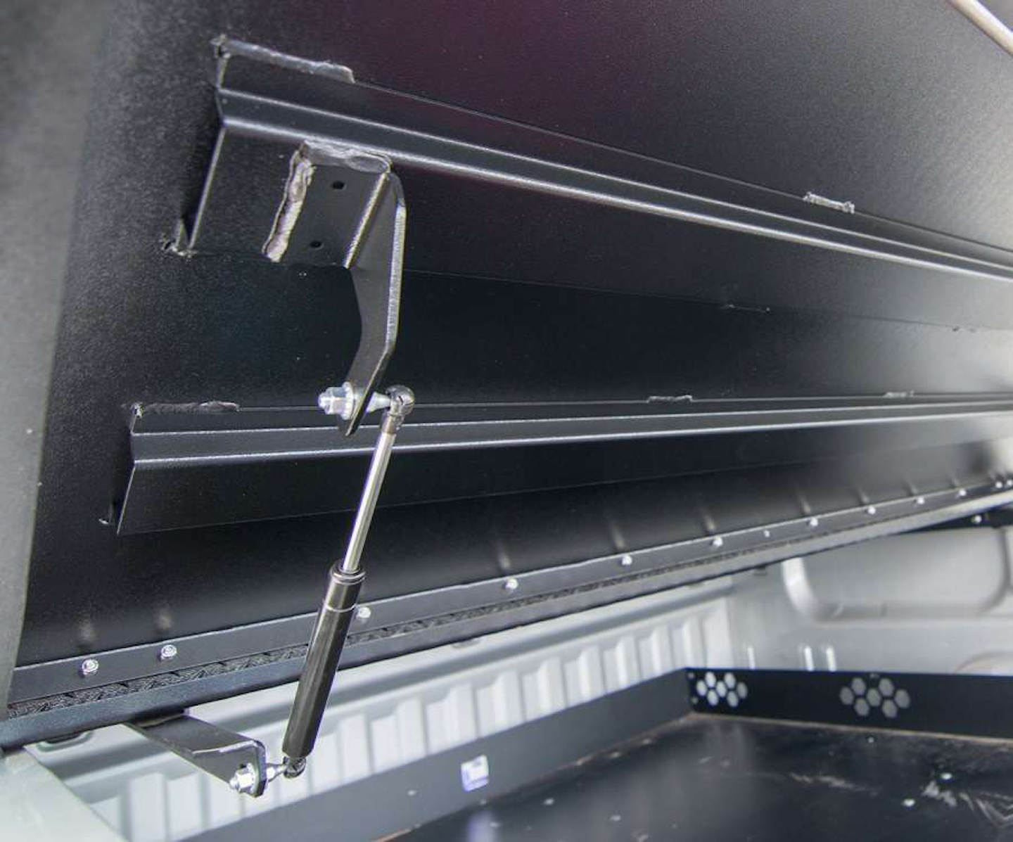 Aluminum tonneau cover provides lightweight, rugged and versatile protection for the gear in