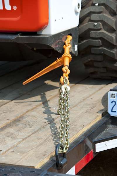 The use of chains with the proper load rating and ratchet-type binders are mandatory for hauling equipment.