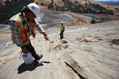 Paleontologist Jim Walker combs the hillside at Calaveras Reservoir for fossils. Credit: Aric Crabb/Bay Area News Group