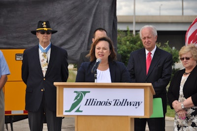 Illinois Tollway Executive Director Kristi Lafleur speaks during the ceremony. Behind her, from left to right, are Allen J. Lynch, State Sen. Terry Link and former State Rep. JoAnn Osmond.