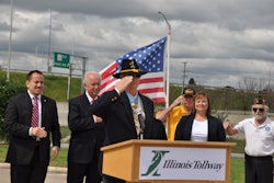 Allen J. Lynch returns a salute from veterans gathered in the audience during the ceremony. (Photo courtesy of the Illinois Tollway)