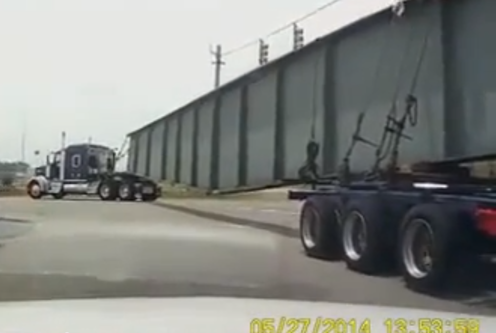 truck hauling steel beam
