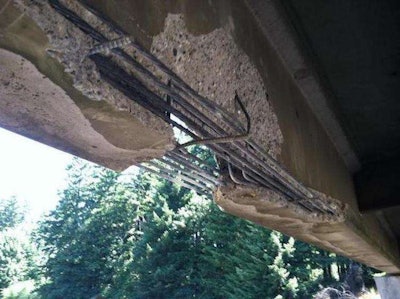 Damage to one of the five bridges hit by an excavator boom in Thurston County, Washington. Credit: WSDOT