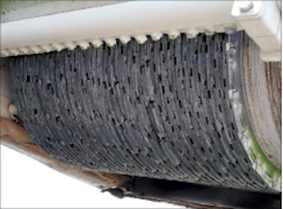 Closely spaced diamond-coated circular saw blades are at the heart of this self-propelled grooving/grinding machine.