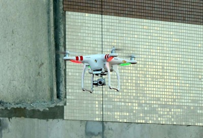The DJI Phantom II is a lightweight drone that can be piloted or set on a course it flies by itself.
