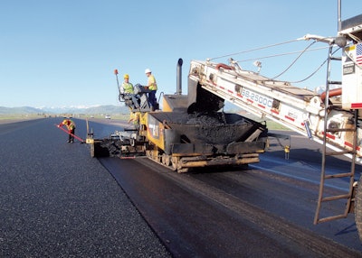 A thin asphalt overlay containing synthetic fibers is placed as part of a runway project at Jackson Hole Airport in Teton County, Wyo. | Photo: FORTA Corp.
