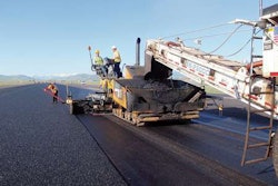At Jackson Hole Airport in Teton County, Wyoming, thin asphalt overlay containing synthetic fibers is placed in this runway project.