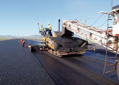 At Jackson Hole Airport in Teton County, Wyoming, thin asphalt overlay containing synthetic fibers is placed in this runway project.