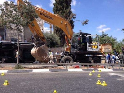 The crime scene in the aftermath of a terrorist attack in Jerusalem carried out with an excavator. Credit: Micky Rosenfeld/Twitter @MickyRosenfeld