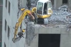 Excavator hammer dangles worker demolition