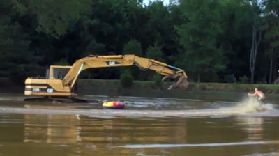 Excavator water skiing