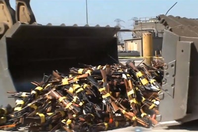 Wheel loaders scooped up nearly 5,000 guns to be melted down for road construction at the LA Sheriff’s Department’s annual Gun Melt.