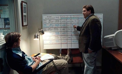 Brad Pitt, as A’s general manager Billy Beane, and Jonah Hill as assistant GM Peter Brand, discuss expected wins and losses based on rosters in the 2011 film “Moneyball.”