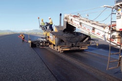 At Jackson Hole Airport in Teton County, Wyoming, thin asphalt overlay containing synthetic fibers is placed in this runway project.