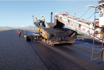 At Jackson Hole Airport in Teton County, Wyoming, thin asphalt overlay containing synthetic fibers is placed in this runway project.