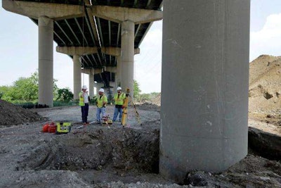 Inspectors discuss tilted columns discovered on a bridge on Interstate 495 in Delaware in 2014.