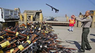 la-me-ln-guns-melted-20130730-001