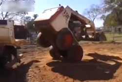 Bobcat wheelie into truck