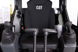 The redesigned cab of the E2 series mini hydraulic excavators features a wider opening and a more ergonomic control layout.