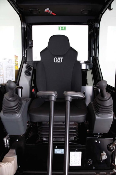 The redesigned cab of the E2 series mini hydraulic excavators features a wider opening and a more ergonomic control layout.