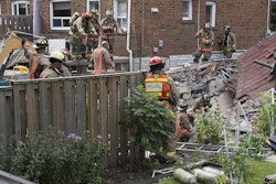 Firefighters searching for survivors dig through the rubble of a collapsed home in Toronto. Credit: Tyler Anderson/National Post