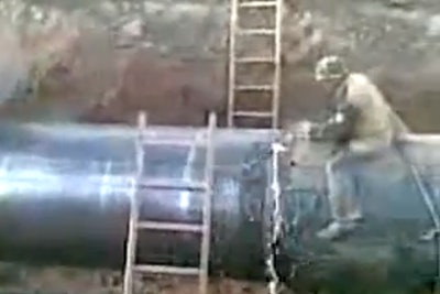 worker bucked during pipe cutting