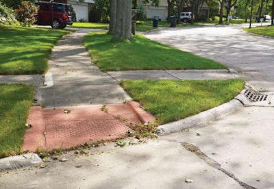 Older and newer: This older-style curb ramp contrasts with a late model in foreground