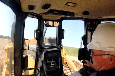 Deere product application consultant Merle Hermsen demonstrates the capabilities of a dozer equipped with a hydrostatic transmission.