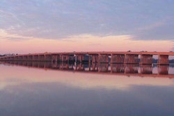 A construction worker is accused of throwing his co-worker from the Gen. William C. Westmoreland Bridge.