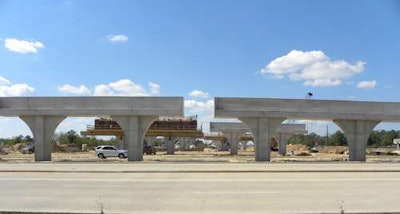 Completed columns and caps on this six-lane highway (three in each direction).