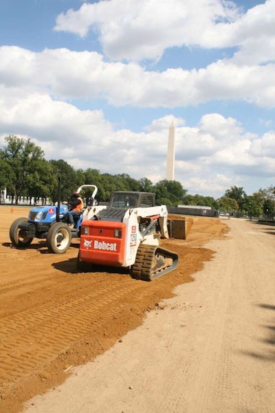 Volunteers from Clark Construction removed 100 truck loads of grass and brought in 2,000 tons of sand, 800 tons of dark topsoil and seven cubic yards of white gravel to create the facescape image.