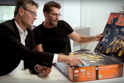 LEGO Technic head of marketing Niels Henrik Horsted, left, and design manager Jeppe Juul Jenson look at the Volvo L350F wheel loader set.