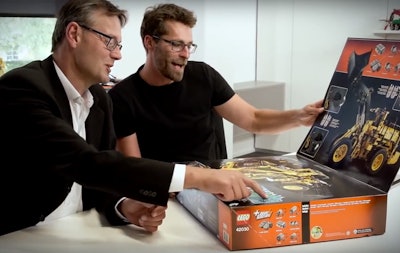 LEGO Technic head of marketing Niels Henrik Horsted, left, and design manager Jeppe Juul Jenson look at the Volvo L350F wheel loader set.