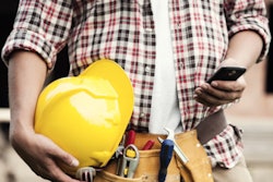 construction contractor worker using smartphone