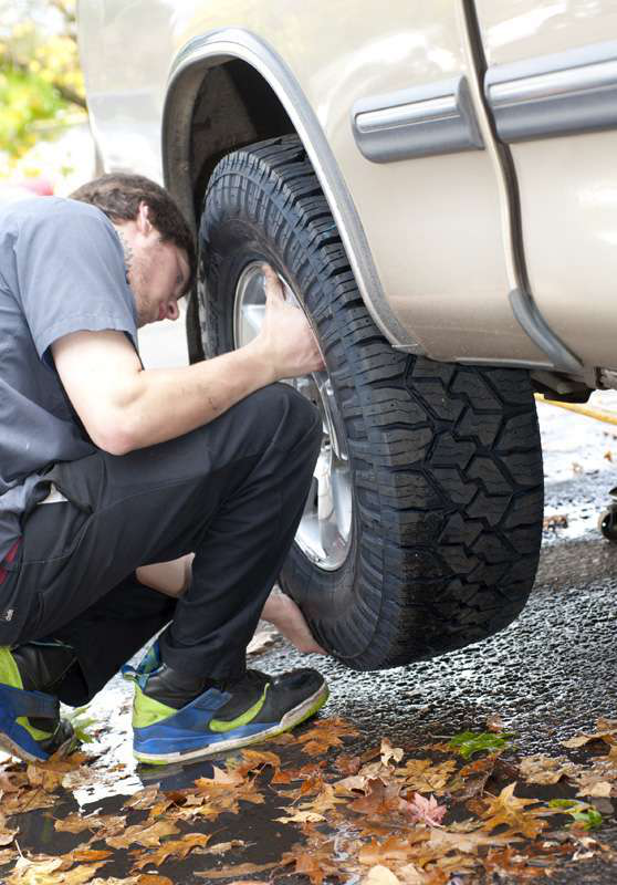 Nitto EXO Grappler AWTs going on customer&rsquo;s truck at the Eugene Tire Factory after tread depth on old tires was found to be only 3/32&Prime;.