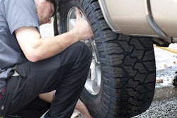 Nitto EXO Grappler AWTs going on customer’s truck at the Eugene Tire Factory after tread depth on old tires was found to be only 3/32″.