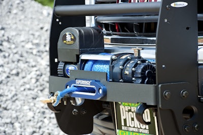 Superwinch Talon 12.5SR winch provides 12,500 pounds of pull using AmSteel Blue synthetic winch line. Go Industries’ grille guard/winch mount protects the truck’s front at the same time.