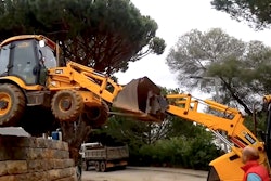 Backhoe buddy system off wall