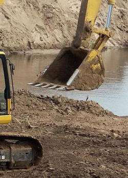 excavator-working-near-water