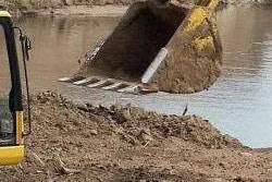 excavator-working-near-water