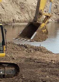 excavator-working-near-water