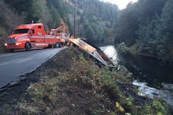 Crews working to remove the truck from the river. | Credit: KCBY.com