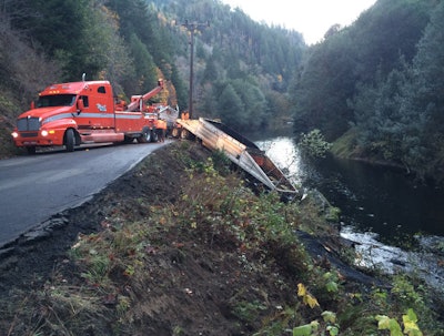Crews working to remove the truck from the river. | Credit: KCBY.com