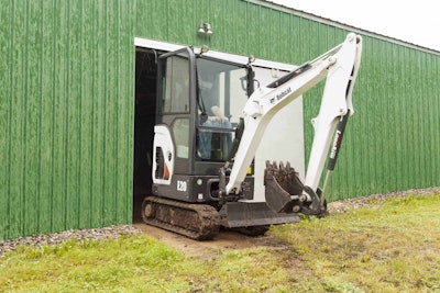 Bobcat Company’s Tier 4-compliant Zero Tail Swing (ZTS) E20 compact excavator in a tight barn space