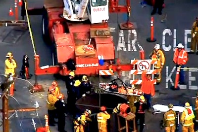 A still from CBS Los Angeles footage of a construction worker in San Gabriel being rescued after a fall into a 40-foot trench.