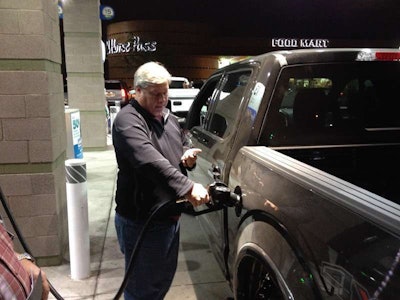 Cars Com's Patrick Olsen Refuels One Of The Dozen Pickups During The 1/2 Ton Shootout