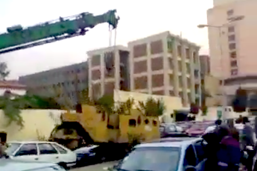 Crane drops roller on top of car