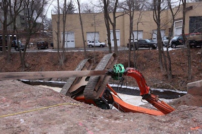 Fire officials snapped this shot of the rolled over excavator. Credit: Meriden Fire Dept. via @MeridenFire on Twitter