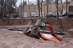 Fire officials snapped this shot of the rolled over excavator. Credit: Meriden Fire Dept. via @MeridenFire on Twitter