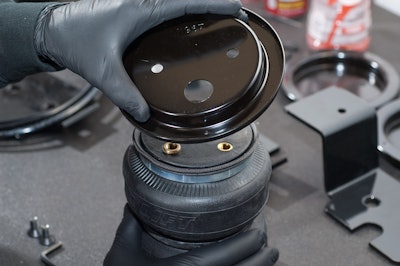 Air Lift Load Lifter 5000 air-helper springs give big boost to level pickups.